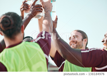 Soccer team, water bottle and exercise cheers with teamwork, achievement and community on grass field. Fitness, workout and sport training of men group with smile and celebration from game with drink Soccer team, water bottle and exercise cheers with teamwork, achievement and community on grass field. Fitness, workout and sport training of men group with smile and celebration from game with drink 138184976