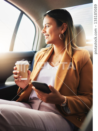 Businesswoman, phone and coffee in car for travel to work with smile in happiness, alone and profile. Young, person and employee with commute to office in taxi, backseat and sitting to look at street Businesswoman, phone and coffee in car for travel to work with smile in happiness, alone and profile. Young, person and employee with commute to office in taxi, backseat and sitting to look at street 138185089