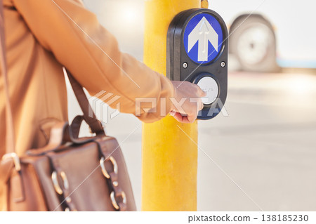 Press, commute and person cross road at traffic light for travel in street with outdoor pedestrian button on the road. Signal, sign and hand of female on symbol of crosswalk by robot in New York Press, commute and person cross road at traffic light for travel in street with outdoor pedestrian button on the road. Signal, sign and hand of female on symbol of crosswalk by robot in New York 138185230