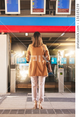Walking, back and a woman at a station for a train, travel and entrance at a platform. Standing, waiting and a person entering a subway or gate for transportation, public traveling or transit Walking, back and a woman at a station for a train, travel and entrance at a platform. Standing, waiting and a person entering a subway or gate for transportation, public traveling or transit 138185239