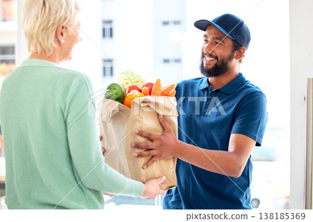 Delivery man, food and smile for customer, groceries and fresh produce from online shopping. Happy courier, supermarket discount and deal from supply chain, distribution with front door service. 138185369