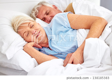 Sleeping, bedroom and senior couple with love, relax and retirement on a weekend break, resting and calm. Peace, old woman or elderly man in a bed, home or morning with care, marriage or relationship Sleeping, bedroom and senior couple with love, relax and retirement on a weekend break, resting and calm. Peace, old woman or elderly man in a bed, home or morning with care, marriage or relationship 138185383