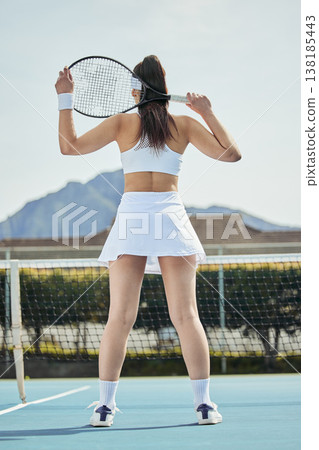 Woman, athlete and tennis court in sportswear, outdoor training and exercising with racket, wellness and posing. Active, aesthetics and healthy player ready for match, competitive and workout game 138185443