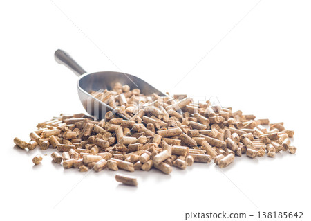 Wood Pellets With Metal Scoop Pile Biomass Fuel For Heating And Renewable Energy Applications Wood Pellets With Metal Scoop Pile Biomass Fuel For Heating And Renewable Energy Applications 138185642