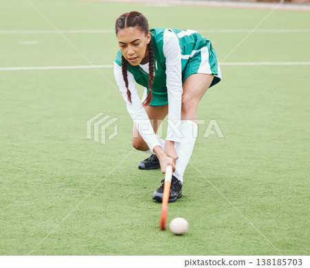 Hockey, sports or girl on turf in fitness training, game or competition with ball, stick or action. Strong woman, athlete or female player in exercise, workout or motion on artificial grass for power Hockey, sports or girl on turf in fitness training, game or competition with ball, stick or action. Strong woman, athlete or female player in exercise, workout or motion on artificial grass for power 138185703