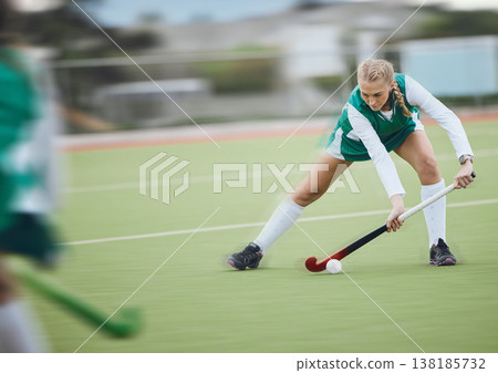 Hockey, athlete and woman running in game, tournament or competition with ball, stick and action on artificial grass. Sports, training and women play in exercise, workout or motion on the ground Hockey, athlete and woman running in game, tournament or competition with ball, stick and action on artificial grass. Sports, training and women play in exercise, workout or motion on the ground 138185732