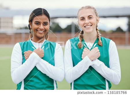 Crossed arms, sports and portrait of friends for hockey on field for training, exercise and workout. Fitness, team and happy women with hand gesture on chest for teamwork, support and bonding in club Crossed arms, sports and portrait of friends for hockey on field for training, exercise and workout. Fitness, team and happy women with hand gesture on chest for teamwork, support and bonding in club 138185766