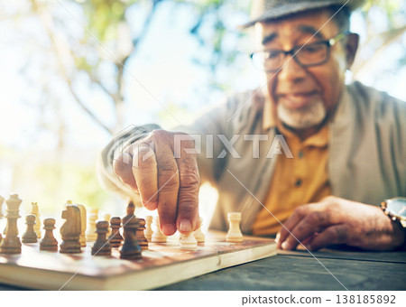 Old man in park, hand with chess game and strategy, competition or challenge, retirement and moving piece. Closeup, planning and contest outdoor, concentration on boardgame and recreation in nature Old man in park, hand with chess game and strategy, competition or challenge, retirement and moving piece. Closeup, planning and contest outdoor, concentration on boardgame and recreation in nature 138185892