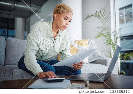 Finance, calculator and woman with a laptop, document or bills with budget planning, home and inflation. Person, paperwork or girl on a sofa, pc or review financial profile with tax and economy 138186212