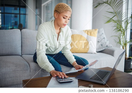 Home, calculator and woman with a laptop, document or investment with budget planning, review financial portfolio or inflation. Person, paperwork or bills on sofa, pc or economy with research or tax Home, calculator and woman with a laptop, document or investment with budget planning, review financial portfolio or inflation. Person, paperwork or bills on sofa, pc or economy with research or tax 138186290
