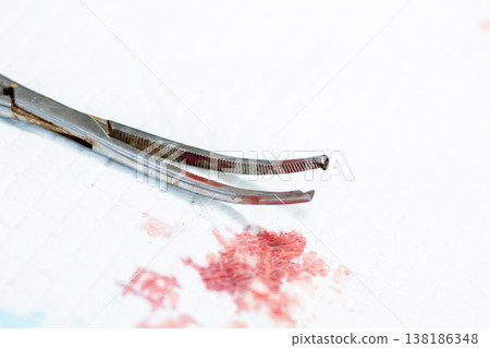 Exact depiction of minor operation involving bloodstained instruments and aseptic conditions 138186348