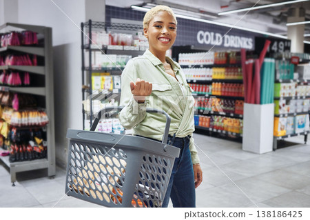 Portrait, basket and smile of woman grocery shopping in retail, supermarket and convenience store for drink. Groceries, market and happy African customer in shop for wholesale soda, sales and juice 138186425