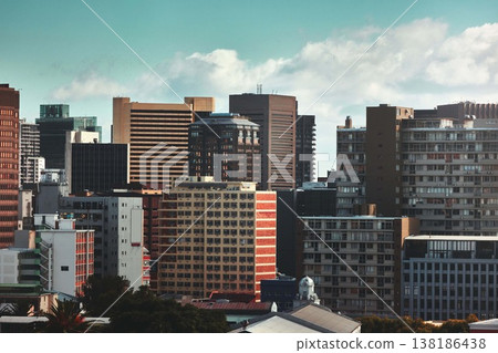 City, buildings and skyscraper with landscape for town infrastructure or architecture outdoor in New York. Development, urban and skyline with cityscape, tower and hotel with modern exterior or roof City, buildings and skyscraper with landscape for town infrastructure or architecture outdoor in New York. Development, urban and skyline with cityscape, tower and hotel with modern exterior or roof 138186438