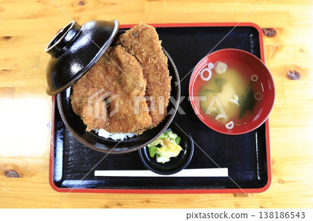 A set meal of waraji katsudon (straw sandal-shaped pork cutlet rice bowl) and miso soup, a local specialty of Chichibu City, Saitama Prefecture. A set meal of waraji katsudon (straw sandal-shaped pork cutlet rice bowl) and miso soup, a local specialty of Chichibu City, Saitama Prefecture. 138186543