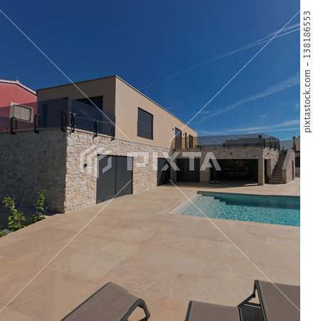 Aerial view of a modular modern smart automated house with pool, stone facade and work in progress Aerial view of a modular modern smart automated house with pool, stone facade and work in progress 138186553