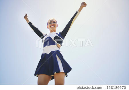 Woman, cheerleader and smile for fitness training outdoor, workout and performance on sky mockup. Happy female person, cheer and sports and celebrate or motivation in uniform to encourage and support 138186670