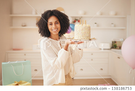 Birthday cake, woman and portrait at home with a smile from celebration and dessert in kitchen. Happy, African female person and food for party and event with candles and hungry for a snack at house Birthday cake, woman and portrait at home with a smile from celebration and dessert in kitchen. Happy, African female person and food for party and event with candles and hungry for a snack at house 138186753