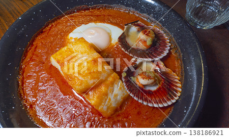 Cod Stewed with Tomato, Egg and Scallops, Spain Cod Stewed with Tomato, Egg and Scallops, Spain 138186921