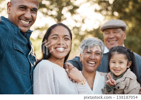 Parents, child and grandparents with portrait in park for memory, smile and bonding for holiday in nature. Men, women and girl kid with hug, face and excited and vacation family in summer sunshine 138187054
