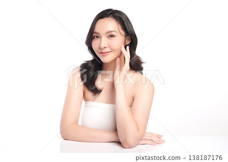 A beautiful young Asian woman with clean, fresh skin against a white background. Skincare, facial treatment, cosmetology, beauty, and spa. An elegant portrait of an Asian woman. A beautiful young Asian woman with clean, fresh skin against a white background. Skincare, facial treatment, cosmetology, beauty, and spa. An elegant portrait of an Asian woman. 138187176