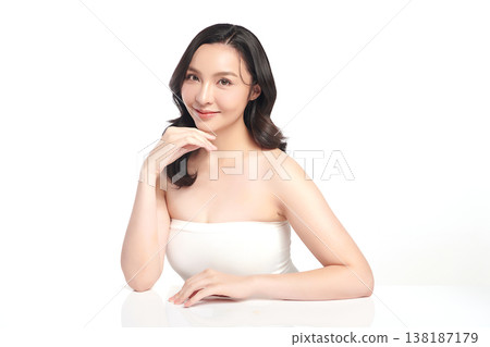 A beautiful young Asian woman with clean, fresh skin against a white background. Skincare, facial treatment, cosmetology, beauty, and spa. An elegant portrait of an Asian woman. A beautiful young Asian woman with clean, fresh skin against a white background. Skincare, facial treatment, cosmetology, beauty, and spa. An elegant portrait of an Asian woman. 138187179