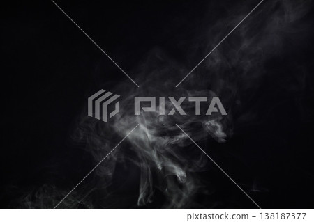Smoke, black background and mist, fog or gas on mockup space wallpaper. Cloud, smog and magic effect on dark backdrop of steam with abstract texture, pollution pattern or incense vapor moving in air Smoke, black background and mist, fog or gas on mockup space wallpaper. Cloud, smog and magic effect on dark backdrop of steam with abstract texture, pollution pattern or incense vapor moving in air 138187377