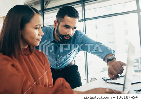 Creative people, laptop and pointing in coaching, teamwork or collaboration together at office. Man helping or training woman or staff on computer in project startup, ideas or strategy at workplace 138187454