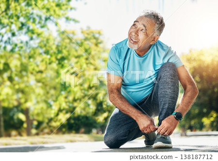 Tying laces, man and in a park for running, exercise and getting ready for outdoor cardio. Smile, idea and a mature or senior male athlete with shoes in the street for a workout, exercise or training Tying laces, man and in a park for running, exercise and getting ready for outdoor cardio. Smile, idea and a mature or senior male athlete with shoes in the street for a workout, exercise or training 138187712