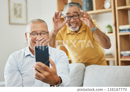 Mature men, friends or smartphone for video call, home or smile on couch in living room, house and happiness. Hands, social media apps and online communication for retirement, conversation and family Mature men, friends or smartphone for video call, home or smile on couch in living room, house and happiness. Hands, social media apps and online communication for retirement, conversation and family 138187770
