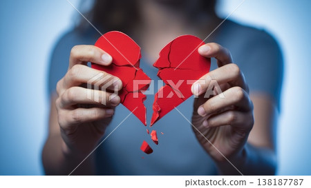 Broken heart in the hands - divorce concept. photo with red heart. 138187787