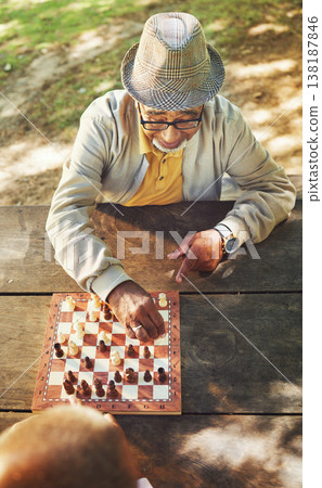 Senior men, chess and game in park, above and moving with strategy, problem solving or competition. Elderly friends, retirement and playing together for contest with king, queen and knight in summer Senior men, chess and game in park, above and moving with strategy, problem solving or competition. Elderly friends, retirement and playing together for contest with king, queen and knight in summer 138187846
