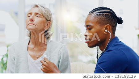 Nurse, senior woman and stethoscope for breathing test for healthcare, wellness or listening for chest problem. Nursing home, listen and breathe with black man, elderly female patient for lung health 138188129