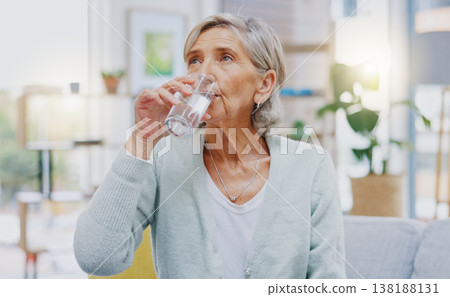 Wellness, home or healthy old woman drinking water for healthcare or natural vitamins in a house. Retirement, elderly relaxing or thirsty senior person refreshing with liquid for energy or hydration 138188131