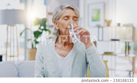 Wellness, home or healthy old woman drinking water for healthcare or natural vitamins in a house. Retirement, elderly relaxing or thirsty senior person refreshing with liquid for energy or hydration 138188133