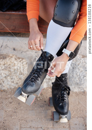 Roller skate, shoes and hands of woman outdoor with exercise, workout or training with wheels on sidewalk or ground. Fun, sport and start fitness with cardio, rollerskating and safety gear in summer 138188216