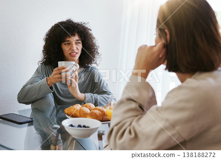 Coffee, breakfast and lesbian couple at table in home, bonding and communication. Drink tea, gay women and girls talking in the morning, eating food and relax together in healthy LGBT relationship Coffee, breakfast and lesbian couple at table in home, bonding and communication. Drink tea, gay women and girls talking in the morning, eating food and relax together in healthy LGBT relationship 138188272