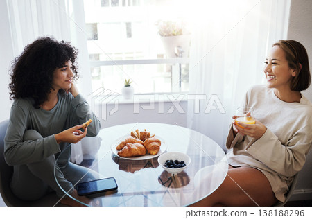 Orange juice, eating breakfast and happy lesbian couple at table in home bonding. Drink, food or croissant of gay women in the morning together for nutrition, diet or healthy interracial relationship 138188296