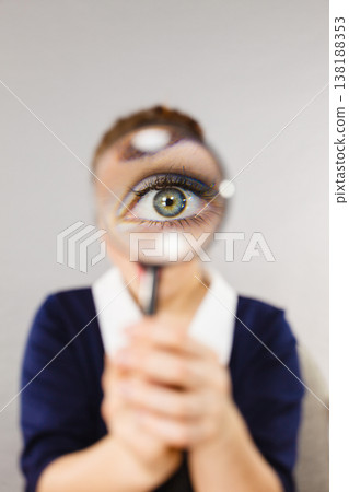Funny woman office working secretary with magnifier Funny woman office working secretary with magnifier 138188353