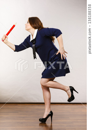 Student woman holding big pencil 138188358
