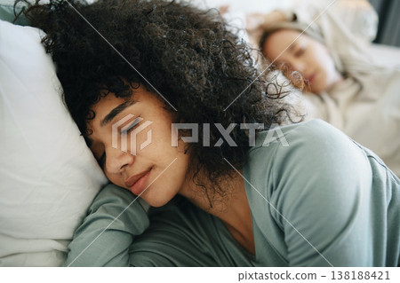 Lgbtq, relax and women sleeping on bed in bedroom with fatigue and love, dream or tired. Exhausted, people and lesbian couple together in home lying on pillow in apartment for wellness and calm Lgbtq, relax and women sleeping on bed in bedroom with fatigue and love, dream or tired. Exhausted, people and lesbian couple together in home lying on pillow in apartment for wellness and calm 138188421