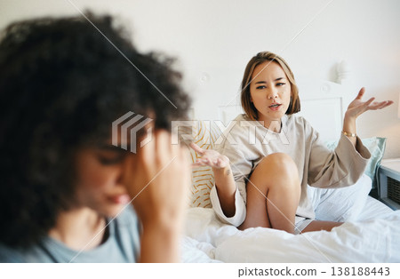 Women, lgbt couple and arguing in bed, home and talking with frustration, stress and headache. Communication, choice and sad for relationship, problems and fight for love, conversation and conflict Women, lgbt couple and arguing in bed, home and talking with frustration, stress and headache. Communication, choice and sad for relationship, problems and fight for love, conversation and conflict 138188443