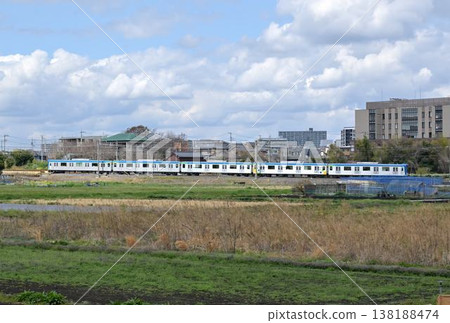 A commuter train on the Tobu Urban Park Line running through the Minuma rice fields. 138188474