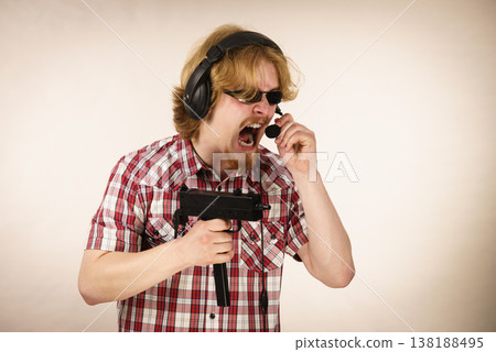 Gamer man shooting from gun Gamer man shooting from gun 138188495