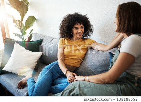 Discussion, love and lesbian couple relaxing on a sofa in the living room talking and bonding. Happy, conversation and young interracial lgbtq women speaking and resting together in lounge at home Discussion, love and lesbian couple relaxing on a sofa in the living room talking and bonding. Happy, conversation and young interracial lgbtq women speaking and resting together in lounge at home 138188552