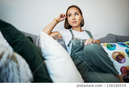 Woman, face and thinking on couch of home for peace, relaxing and living room in apartment. Person, calm and wellness for self care and zen with ideas, thoughts and inspiration in lounge on sofa 138188554