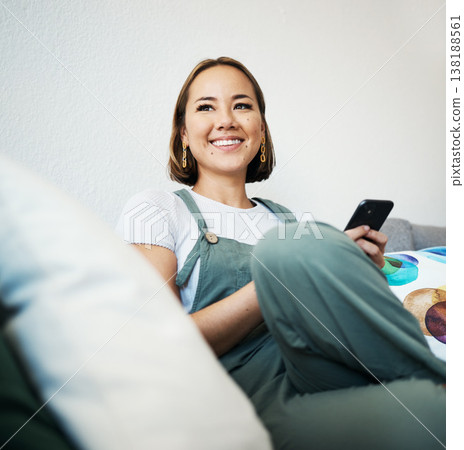 Woman, phone and thinking on couch of home for social media, internet post or conversation with smile. Person, smartphone and happiness for communication, networking and connectivity with technology Woman, phone and thinking on couch of home for social media, internet post or conversation with smile. Person, smartphone and happiness for communication, networking and connectivity with technology 138188561