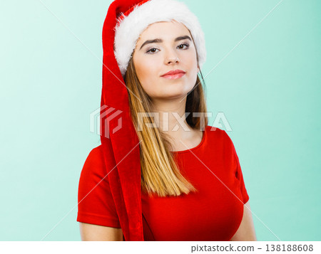Woman wearing Santa Claus helper costume Woman wearing Santa Claus helper costume 138188608