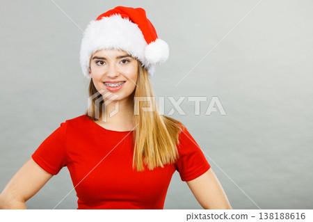 Positive woman wearing Santa Claus helper costume Positive woman wearing Santa Claus helper costume 138188616