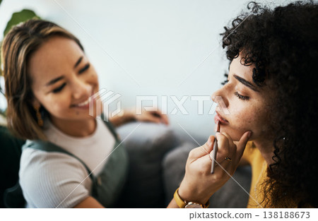 Friends, woman and relax with makeup in home with closeup for cosmetics, beauty and wellness. Young, people helping and apply lipstick with hand by holding, product and peace in happy with precision Friends, woman and relax with makeup in home with closeup for cosmetics, beauty and wellness. Young, people helping and apply lipstick with hand by holding, product and peace in happy with precision 138188673