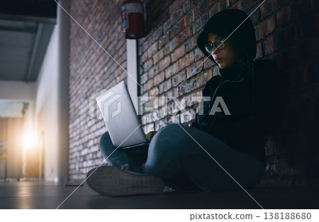 Hacker, woman in dark room with laptop and programming, phishing and cyber crime with database or server. Cybersecurity, information technology and criminal with pc, ransomware and firewall breach Hacker, woman in dark room with laptop and programming, phishing and cyber crime with database or server. Cybersecurity, information technology and criminal with pc, ransomware and firewall breach 138188680